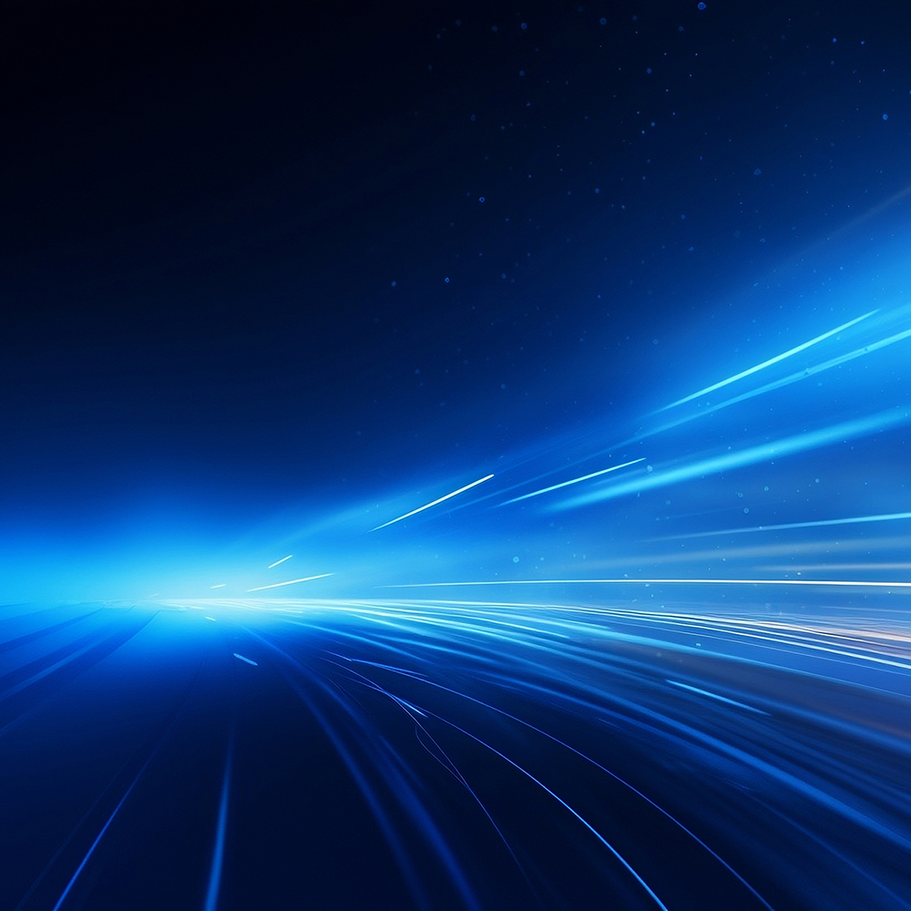 Das Bild zeigt eine futuristische Aufnahme von Lichtstreifen, welche auf einen Punkt zulaufen, verschiedene Blautöne und helle Highlights.- Titelbild des TBF THE BRIGHT FUTURE