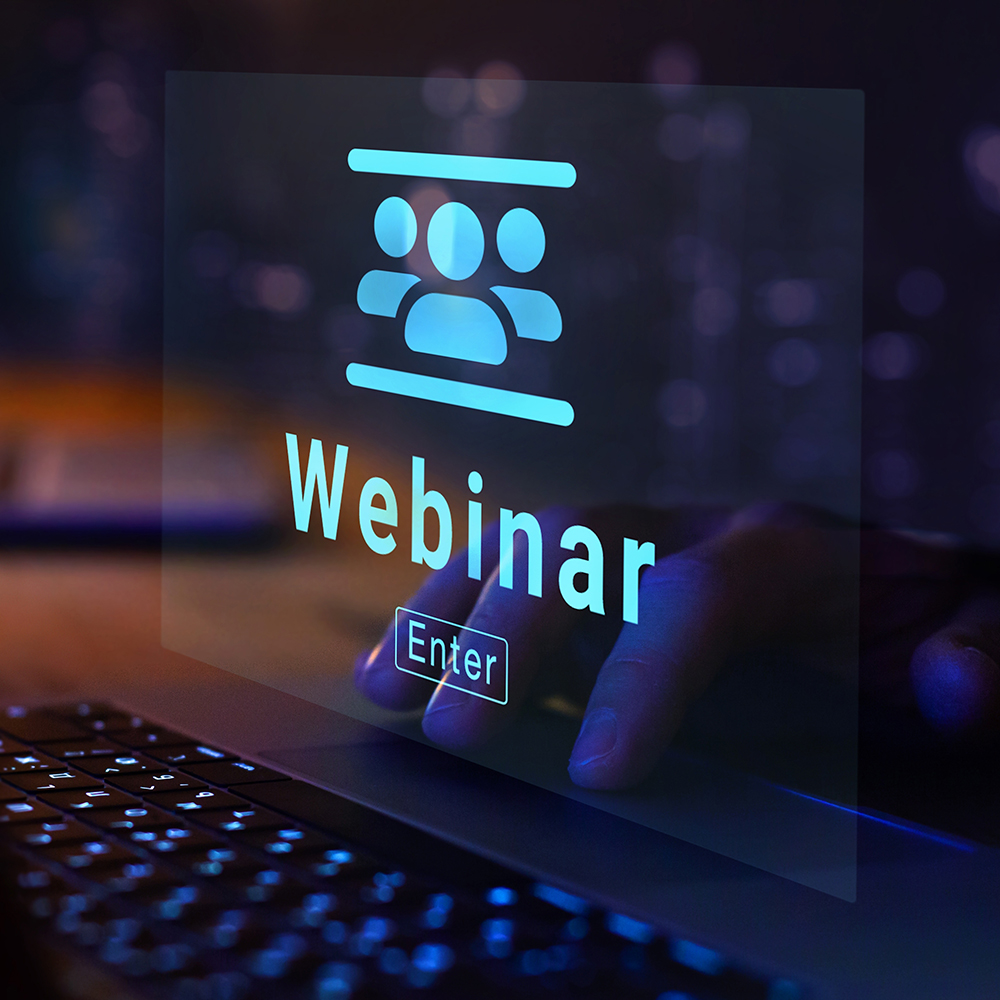 Das Bild zeigt ein Bildschirm mit dem Wort Webinar